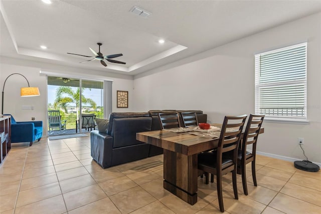 3467 Buoy Cir, Winter Garden, FL 34787 - dining area featuring a tray ceiling, ceiling fan, light tile patterned floors, and recessed lighting