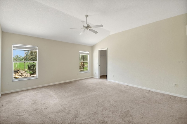 2880 Manor Downs, The Villages, FL 32162 - empty room featuring ceiling fan, vaulted ceiling, and light carpet