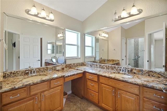 2880 Manor Downs, The Villages, FL 32162 - bathroom featuring lofted ceiling, a shower stall, vanity, and tile patterned floors