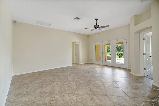 2880 Manor Downs, The Villages, FL 32162 - unfurnished room with french doors, arched walkways, and a ceiling fan