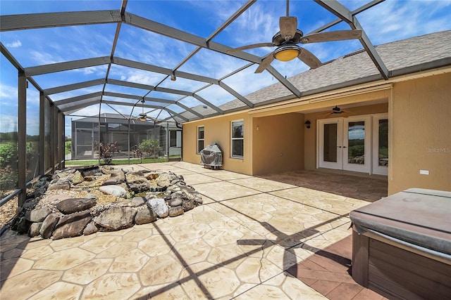 2880 Manor Downs, The Villages, FL 32162 - view of patio featuring a hot tub, ceiling fan, glass enclosure, and french doors