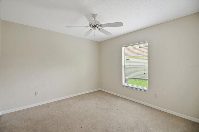 2880 Manor Downs, The Villages, FL 32162 - unfurnished room with plenty of natural light, light carpet, and a ceiling fan