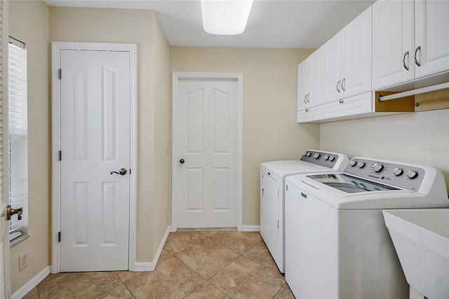 2880 Manor Downs, The Villages, FL 32162 - laundry room featuring cabinet space, washing machine and dryer, and light tile patterned flooring