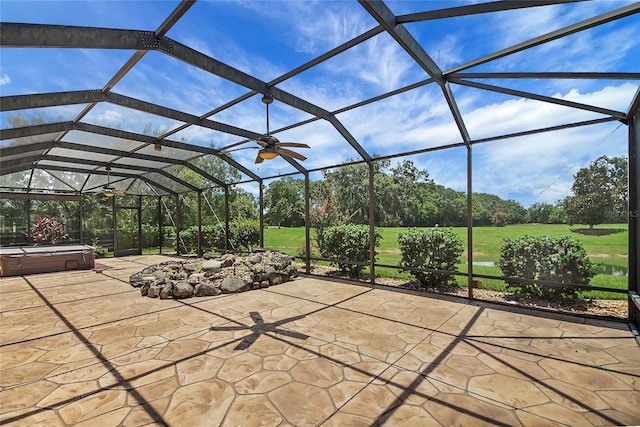 2880 Manor Downs, The Villages, FL 32162 - view of patio featuring a hot tub, glass enclosure, and view of scattered trees