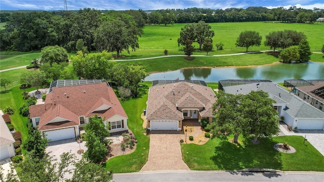 2880 Manor Downs, The Villages, FL 32162 - aerial view of property and surrounding area featuring a nearby body of water and a tree filled landscape