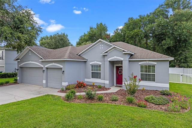 1702 Hoofprint Ct, Fruitland Park, FL 34731 - ranch-style house featuring a shingled roof, a garage, stucco siding, and driveway