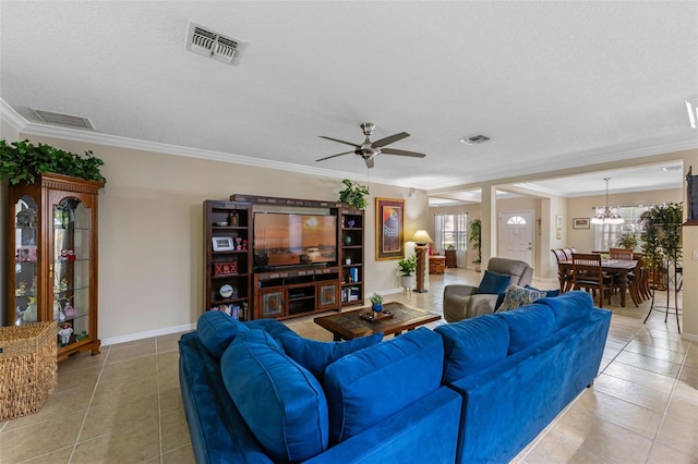 1702 Hoofprint Ct, Fruitland Park, FL 34731 - living area with ornamental molding, light tile patterned floors, ceiling fan, and a chandelier
