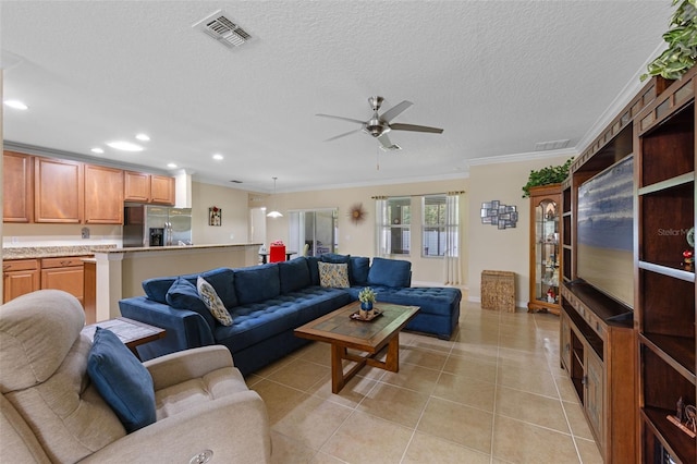 1702 Hoofprint Ct, Fruitland Park, FL 34731 - living room with ornamental molding, a ceiling fan, recessed lighting, light tile patterned floors, and a textured ceiling