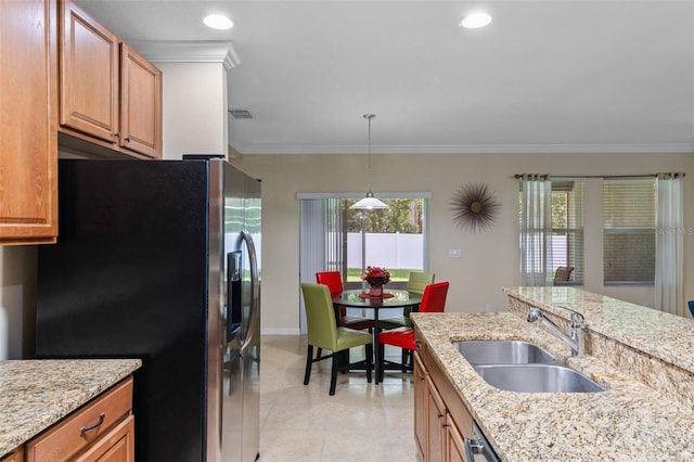 1702 Hoofprint Ct, Fruitland Park, FL 34731 - kitchen with stainless steel fridge with ice dispenser, crown molding, light tile patterned flooring, light stone counters, and hanging light fixtures