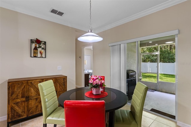 1702 Hoofprint Ct, Fruitland Park, FL 34731 - dining area with crown molding and light tile patterned floors