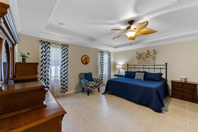 1702 Hoofprint Ct, Fruitland Park, FL 34731 - bedroom featuring a raised ceiling, ornamental molding, light tile patterned floors, a textured ceiling, and ceiling fan