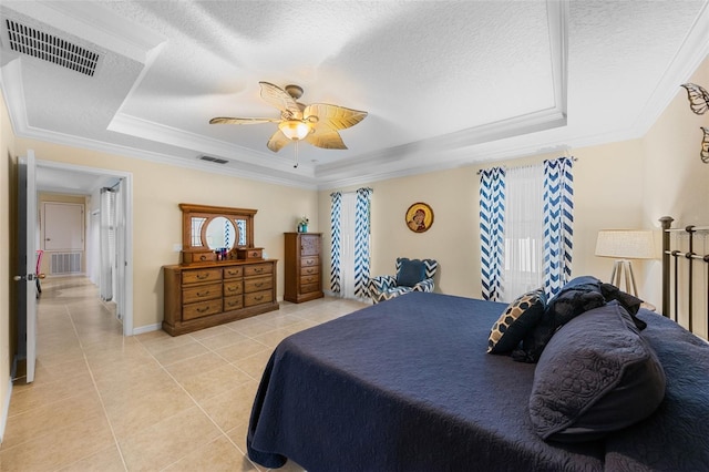 1702 Hoofprint Ct, Fruitland Park, FL 34731 - bedroom featuring a tray ceiling, light tile patterned flooring, crown molding, a textured ceiling, and a ceiling fan