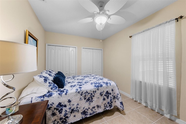 1702 Hoofprint Ct, Fruitland Park, FL 34731 - tiled bedroom with multiple closets and ceiling fan