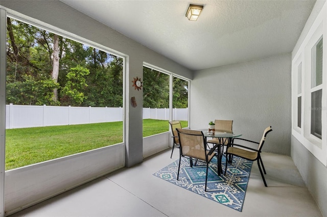 1702 Hoofprint Ct, Fruitland Park, FL 34731 - sunroom featuring outdoor dining area