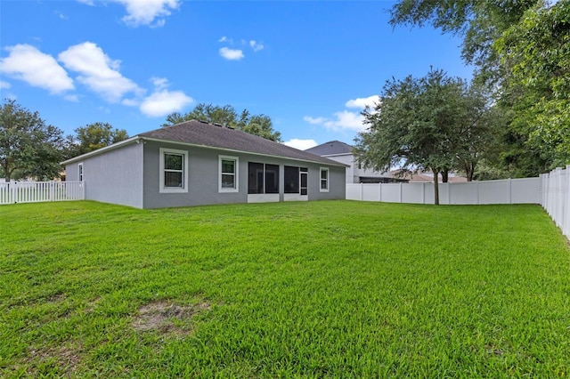 1702 Hoofprint Ct, Fruitland Park, FL 34731 - back of property featuring stucco siding and a fenced backyard