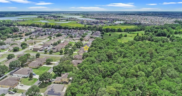 1702 Hoofprint Ct, Fruitland Park, FL 34731 - aerial overview of property's location with nearby suburban area and a nearby body of water
