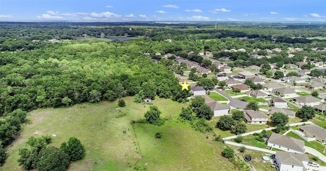 1702 Hoofprint Ct, Fruitland Park, FL 34731 - aerial view of property and surrounding area featuring a heavily wooded area