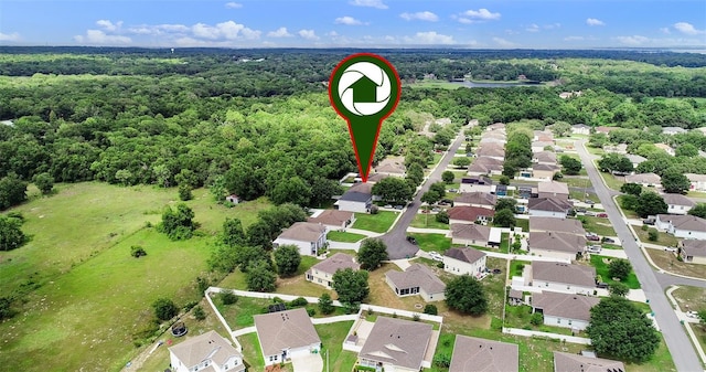 1702 Hoofprint Ct, Fruitland Park, FL 34731 - aerial perspective of suburban area featuring a heavily wooded area