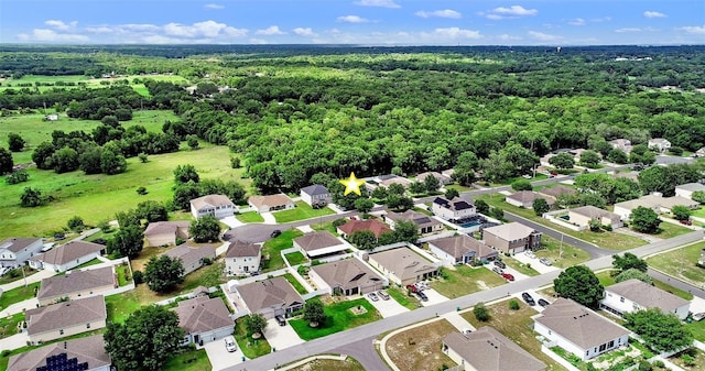1702 Hoofprint Ct, Fruitland Park, FL 34731 - aerial perspective of suburban area with a forest