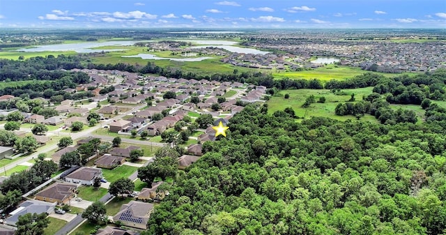 1702 Hoofprint Ct, Fruitland Park, FL 34731 - aerial overview of property's location featuring a large body of water and nearby suburban area