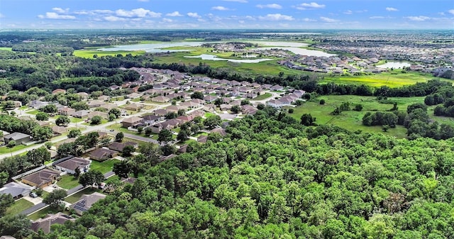 1702 Hoofprint Ct, Fruitland Park, FL 34731 - aerial overview of property's location featuring nearby suburban area and a large body of water