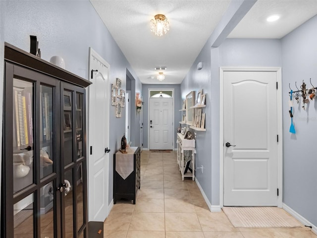 2710 Lilyturf Ct, Tavares, FL 32778 - foyer featuring light tile patterned floors and baseboards