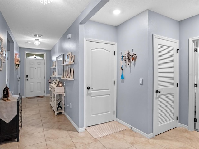 2710 Lilyturf Ct, Tavares, FL 32778 - foyer entrance featuring light tile patterned flooring and a textured ceiling