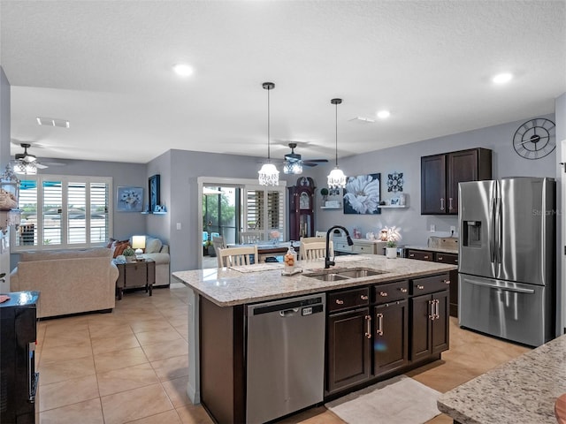 2710 Lilyturf Ct, Tavares, FL 32778 - kitchen featuring appliances with stainless steel finishes, a ceiling fan, a center island with sink, plenty of natural light, and recessed lighting