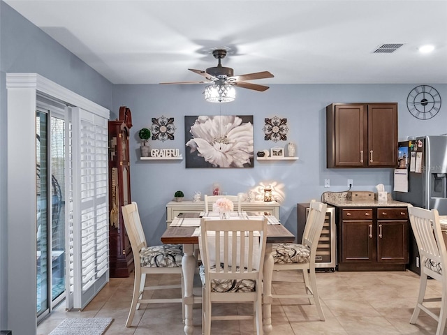 2710 Lilyturf Ct, Tavares, FL 32778 - dining area featuring wine cooler, ceiling fan, and light tile patterned floors