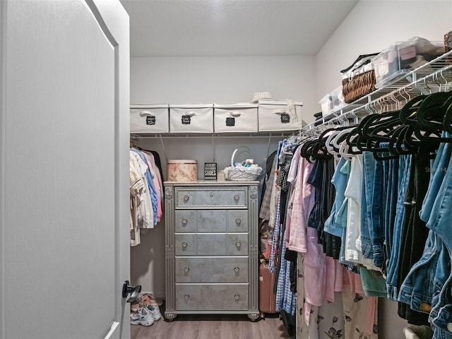 2710 Lilyturf Ct, Tavares, FL 32778 - walk in closet with wood finished floors