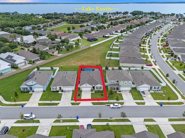 2710 Lilyturf Ct, Tavares, FL 32778 - aerial perspective of suburban area featuring property boundaries highlighted and a large body of water