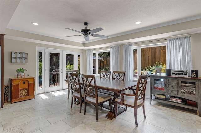 628 Drew Ave, Clermont, FL 34711 - dining area featuring french doors, a ceiling fan, a textured ceiling, recessed lighting, and crown molding