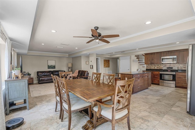 628 Drew Ave, Clermont, FL 34711 - dining area with a tray ceiling, a ceiling fan, recessed lighting, and ornamental molding