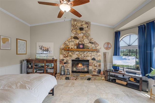 628 Drew Ave, Clermont, FL 34711 - bedroom featuring lofted ceiling, crown molding, a fireplace, a ceiling fan, and a wainscoted wall