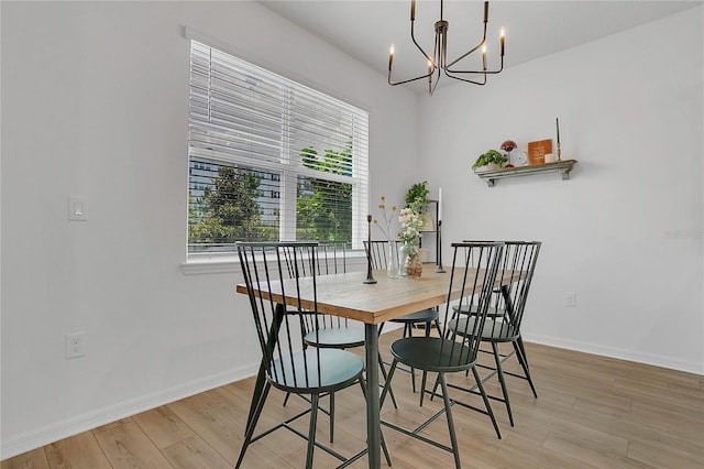 2755 Bobcat Chase Blvd, Oakland, FL 34787 - dining room featuring a chandelier and light wood-type flooring