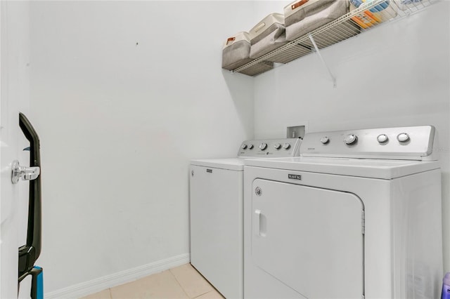 2755 Bobcat Chase Blvd, Oakland, FL 34787 - laundry area with washing machine and dryer and light tile patterned flooring