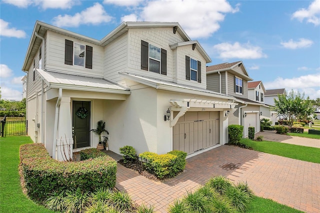 2755 Bobcat Chase Blvd, Oakland, FL 34787 - view of front of property with stucco siding, a garage, decorative driveway, and a metal roof