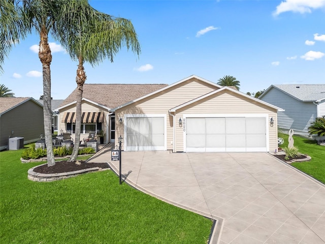 2620 Persimmon Loop, The Villages, FL 32162 - ranch-style house with driveway, an attached garage, and a front lawn