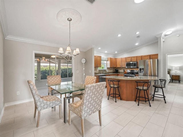 2620 Persimmon Loop, The Villages, FL 32162 - dining room featuring plenty of natural light, a chandelier, ornamental molding, recessed lighting, and light tile patterned floors