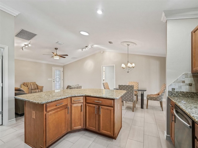2620 Persimmon Loop, The Villages, FL 32162 - kitchen with dishwasher, crown molding, track lighting, light stone countertops, and a center island