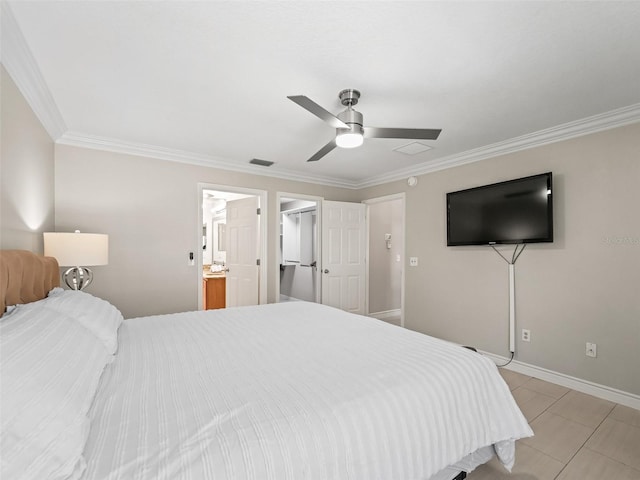 2620 Persimmon Loop, The Villages, FL 32162 - bedroom with crown molding, a ceiling fan, a walk in closet, light tile patterned floors, and connected bathroom