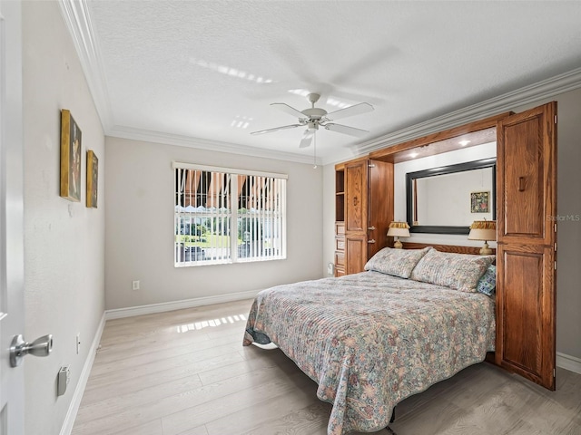 2620 Persimmon Loop, The Villages, FL 32162 - bedroom with ornamental molding, light wood-style floors, and ceiling fan