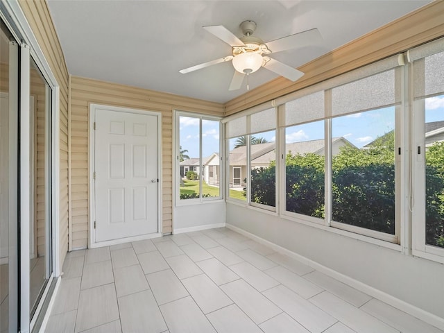 2620 Persimmon Loop, The Villages, FL 32162 - unfurnished sunroom with ceiling fan and healthy amount of natural light