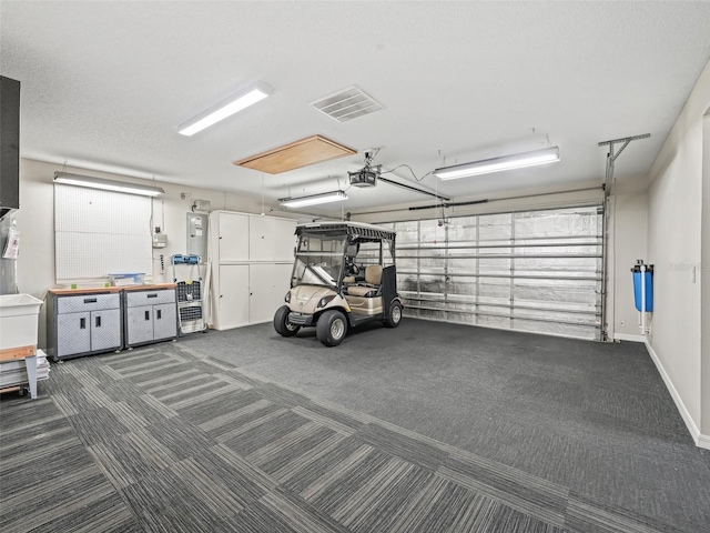 2620 Persimmon Loop, The Villages, FL 32162 - garage with a garage door opener