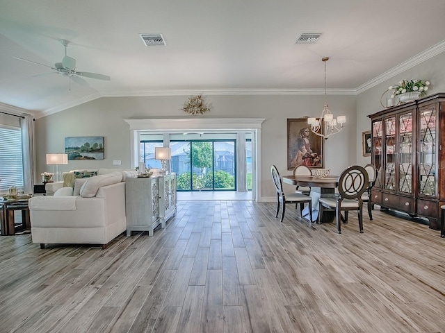 6295 Danielson Loop, The Villages, FL 32163 - living area with a chandelier, light wood finished floors, ceiling fan, crown molding, and vaulted ceiling