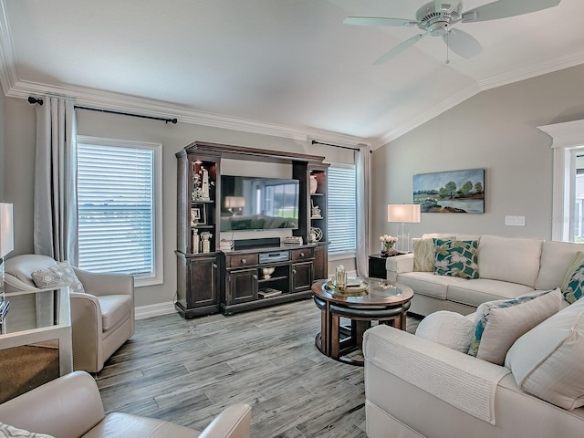 6295 Danielson Loop, The Villages, FL 32163 - living area featuring vaulted ceiling, ornamental molding, ceiling fan, and light wood-type flooring