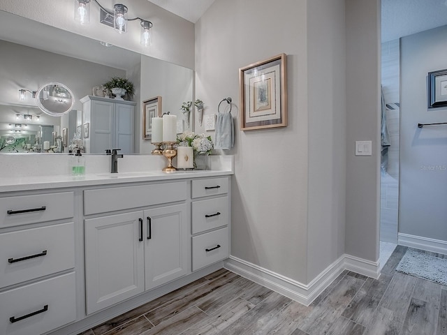 6295 Danielson Loop, The Villages, FL 32163 - bathroom featuring wood finished floors and vanity