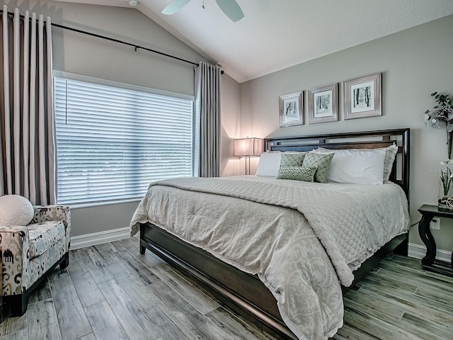 6295 Danielson Loop, The Villages, FL 32163 - bedroom featuring wood finished floors, lofted ceiling, and ceiling fan