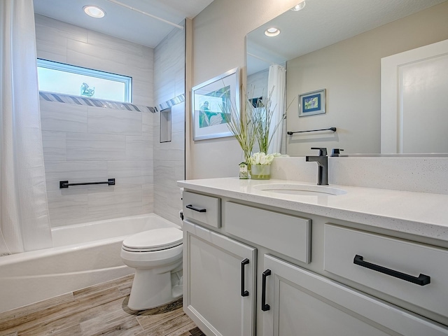 6295 Danielson Loop, The Villages, FL 32163 - bathroom featuring vanity, shower / bathtub combination with curtain, wood finished floors, and recessed lighting