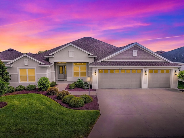 6295 Danielson Loop, The Villages, FL 32163 - ranch-style house with a garage, concrete driveway, a front lawn, stucco siding, and roof with shingles